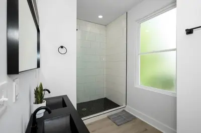 a bathroom with a shower and a sink at Heights on Wayne by Blackhouse in Cincinnati