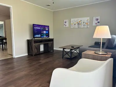 a living room with a couch and a tv at Bellwood 2 bed family house w 2 living areas Superhost in Loveland