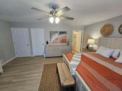 a bedroom with two beds and a ceiling fan at New Construction 4 Bedroom Ranch in Trenton in Trenton