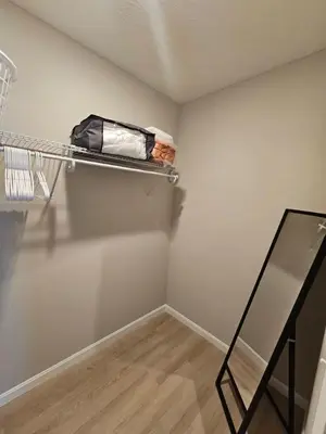 an empty room with a shelf and a mirror at New Construction 4 Bedroom Ranch in Trenton in Trenton