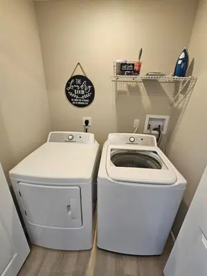 a small laundry room with a washer and dryer at New Construction 4 Bedroom Ranch in Trenton in Trenton