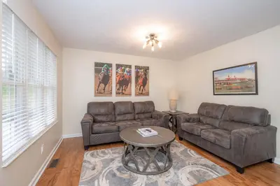 a living room with a couch and a table at Horse Haven - 4 BDR Charmer Close to Ark Encounter in Williamstown