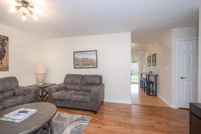 a living room with a couch and a chair and a table at Horse Haven - 4 BDR Charmer Close to Ark Encounter in Williamstown