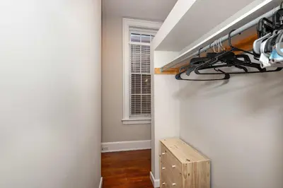 a small hallway with a room with a window at Loft Life Pendleton 2 - Chic Downtown Condo for 4 in Cincinnati