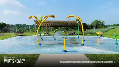 a splash park with a playground with a water slide at 5 Neighboring Cabins at Eden Reserve - Front Five in Williamstown