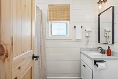 a bathroom with a sink and a window at The Lodges at Eden Reserve - Back Cabins - Near Ark in Williamstown