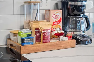 a wooden tray filled with food on a kitchen counter at The Lodges at Eden Reserve - Back Cabins - Near Ark in Williamstown