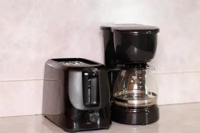 a coffee maker and a blender sitting on a counter at 3 bedrooms at Cleveland in Euclid