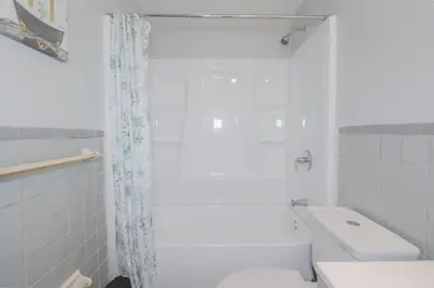 a bathroom with a shower and a toilet and a sink at 3 bedrooms at Cleveland in Euclid