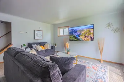 a living room with two couches and a table at 3 bedrooms at Cleveland in Euclid