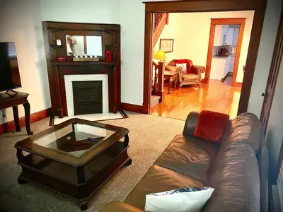 a living room with a couch and a coffee table at London Maisonette - Black Door in London