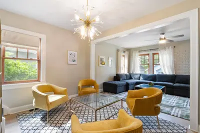 a living room with a couch and chairs at Spacious 3 bed 2 and a half bath 2pk spot in Cincinnati