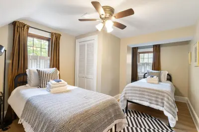 a bedroom with two beds and a ceiling fan at Spacious 3 bed 2 and a half bath 2pk spot in Cincinnati