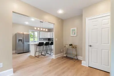 a kitchen with a white door and a counter at Spacious 3 bed 2 and a half bath 2pk spot in Cincinnati