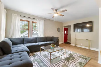 a living room with a couch and a table at Spacious 3 bed 2 and a half bath 2pk spot in Cincinnati