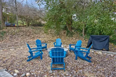 a group of blue chairs and a table at Green Destiny! 7min to DT Cincy, Pool & Hottub in Ludlow
