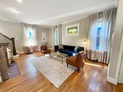 a living room with a blue couch and chairs at Cute & Cozy 2 bed 1 and a half bath Oakley in Cincinnati