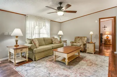 a living room with a couch and a table at Well and Cellar Near Kanawha River and ATV Trails!