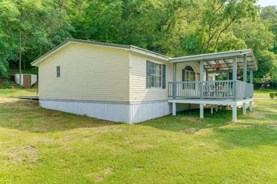 a small house with a porch and a deck at Well and Cellar Near Kanawha River and ATV Trails!