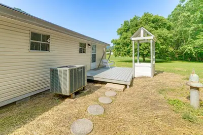 a backyard with a heater and a house at Well and Cellar Near Kanawha River and ATV Trails!