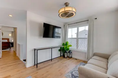 a living room with a couch and a tv at Steps to Buckeye Lake Family-Friendly Home in Buckeye Lake