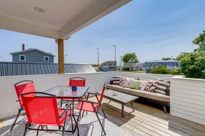a patio with a couch and chairs on a deck at Steps to Buckeye Lake Family-Friendly Home in Buckeye Lake
