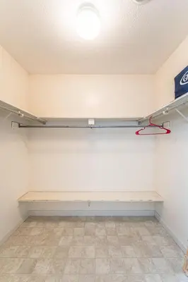 an empty room with a shelf on the wall at Country Cottage in Apple Creek