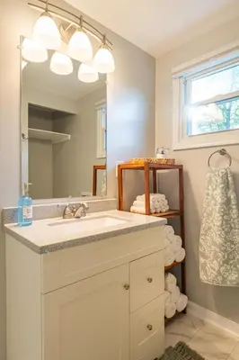 a bathroom with a sink and a mirror at White Oak Cottage in Mount Orab