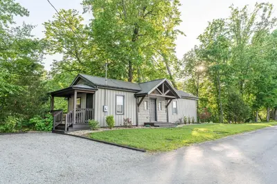 a house on a street with a driveway at White Oak Cottage in Mount Orab