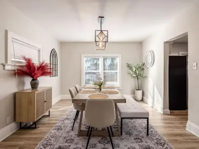 a dining room with a table and chairs at Oakwood Charm Family-Friendly 3BR Getaway in Columbus
