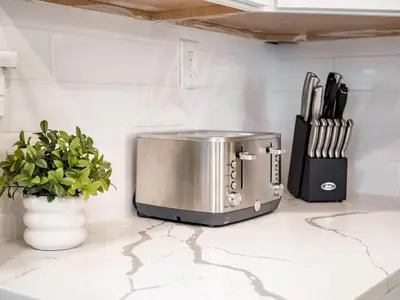 a toaster sitting on top of a kitchen counter at Oakwood Charm Family-Friendly 3BR Getaway in Columbus