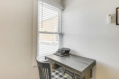 a room with a table and a window with a phone on it at 2 Mi to Ark Encounter Condo on Main Street! in Williamstown