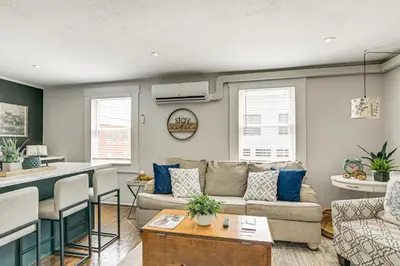a living room with a couch and a table at 2 Mi to Ark Encounter Condo on Main Street! in Williamstown