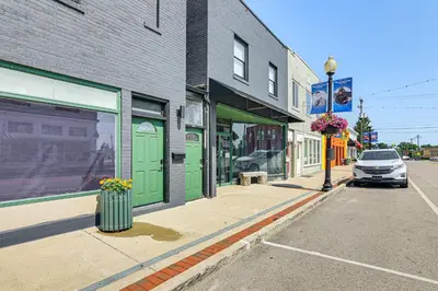 a car parked in front of a building on a street at 2 Mi to Ark Encounter Condo on Main Street! in Williamstown