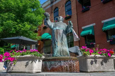 a statue of a woman standing in front of a fountain at Mt Adams Nest - Studio for 2 in Cincinnati