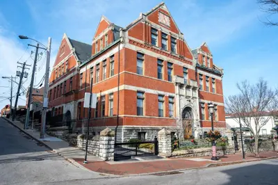 a red brick building on the corner of a street at Mt Adams Nest - Studio for 2 in Cincinnati