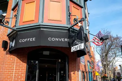 a coffee shop with a black awning on a building at Mt Adams Nest - Studio for 2 in Cincinnati