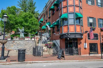 a building on a street with a statue in front of it at Mt Adams Nest - Studio for 2 in Cincinnati