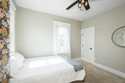 a bedroom with a bed and a ceiling fan at Ludlow Lodge with City Views in Ludlow