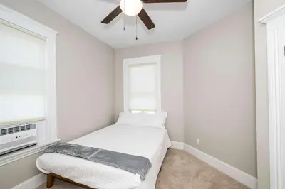 a bedroom with a bed and a ceiling fan at Ludlow Lodge with City Views in Ludlow