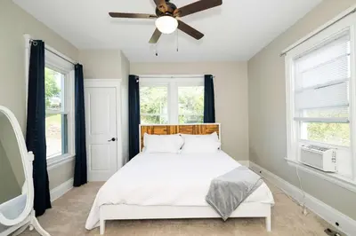 a bedroom with a bed and a ceiling fan at Ludlow Lodge with City Views in Ludlow