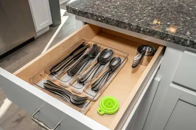 a drawer filled with utensils in a kitchen at Ark Adventure Retreat in Walton