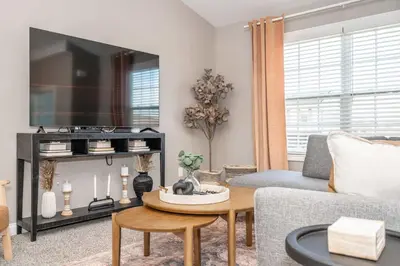 a living room with a couch and a table at Ark Adventure Retreat in Walton