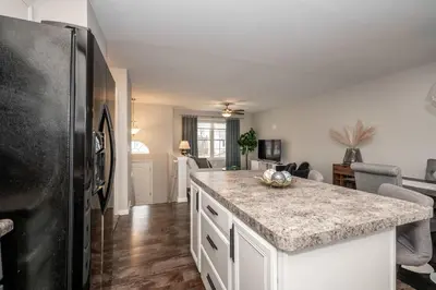 a kitchen with a counter top and a refrigerator at The Gem Vacation Rental in Walton