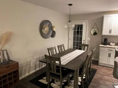 a dining room with a table and chairs at The Gem Vacation Rental in Walton