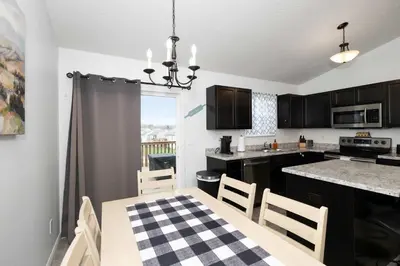 a kitchen and dining room with a table and chairs at The Ark Encounter Retreat in Walton