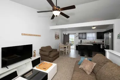 a living room with a couch and a ceiling fan at The Ark Encounter Retreat in Walton