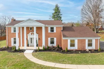 a red brick house with a gambrel at Tallen Manor & Retreat in Hamilton