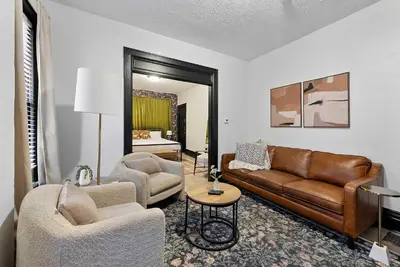 a living room with a couch and two chairs at Merion Village Residences 1166 in Columbus