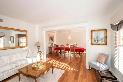a living room with a white couch and a table at Luxurious Dream Home - For 10 in Loveland